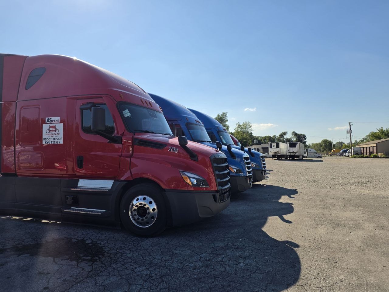 Row of Freightage tractors parked at the yard