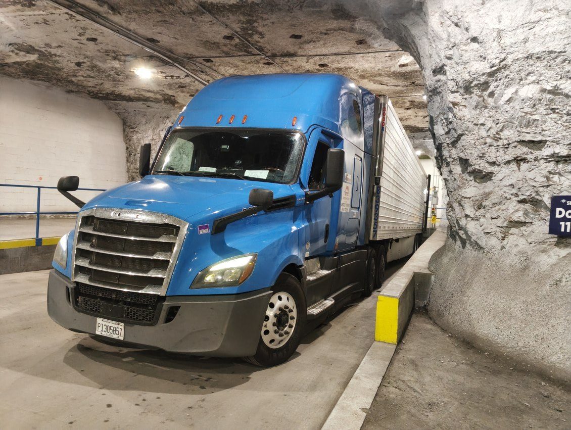 Freightage truck and trailer at a warehouse dock