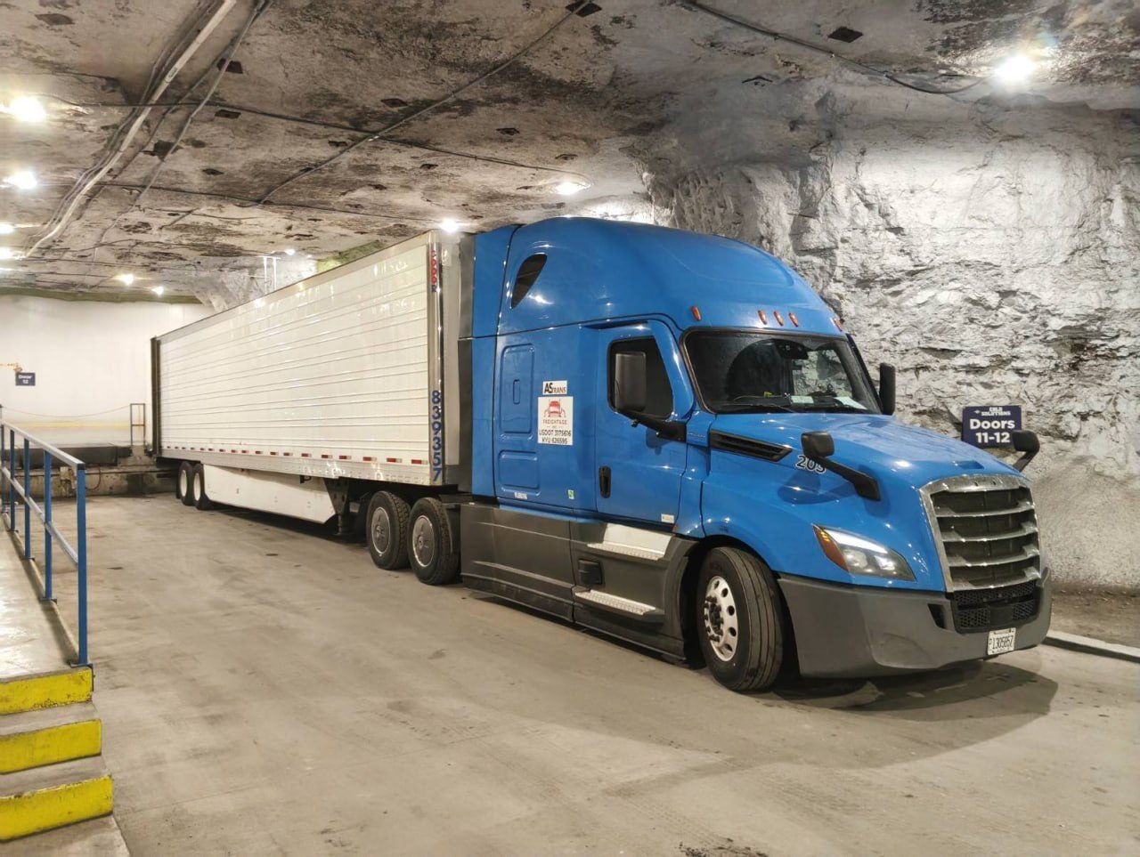 Freightage truck with reefer trailer at a loading dock